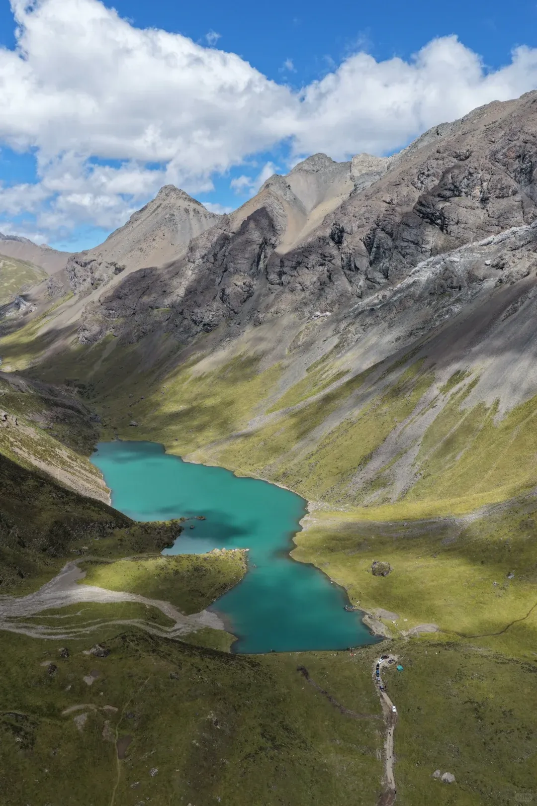 Bird's-eye view of the gourd-shaped Changhaizi Lake set in a U-shaped valley, blue-green water framed by rocky ridges