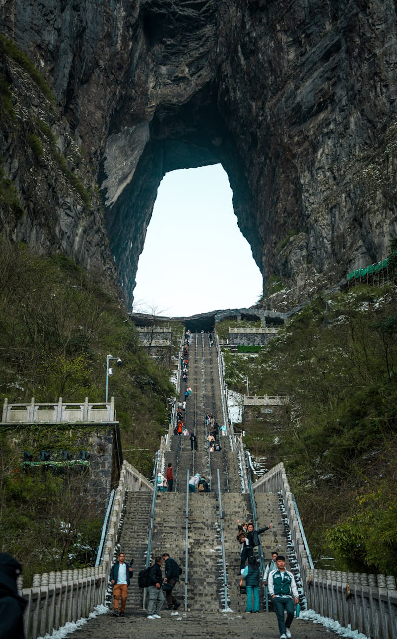 Looking up at Tianmen Cave through the 999-step Stairway to Heaven — the natural arch is 131.5 meters tall