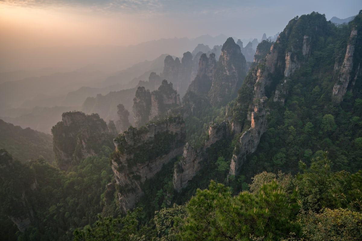 Sandstone pillars of Wulingyuan at dusk — three days covers Yuanjiajie, Tianzi Mountain, and Tianmen without rushing