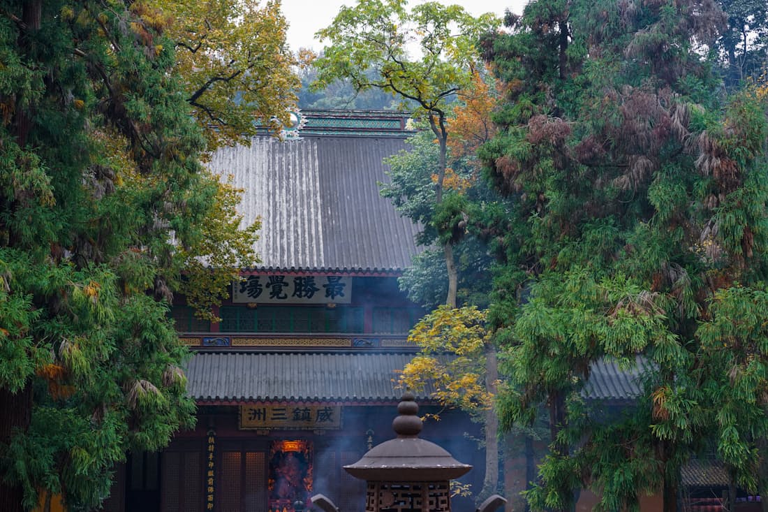 Incense smoke drifts past the halls of Lingyin Temple — entry is free but reserve a slot the day before